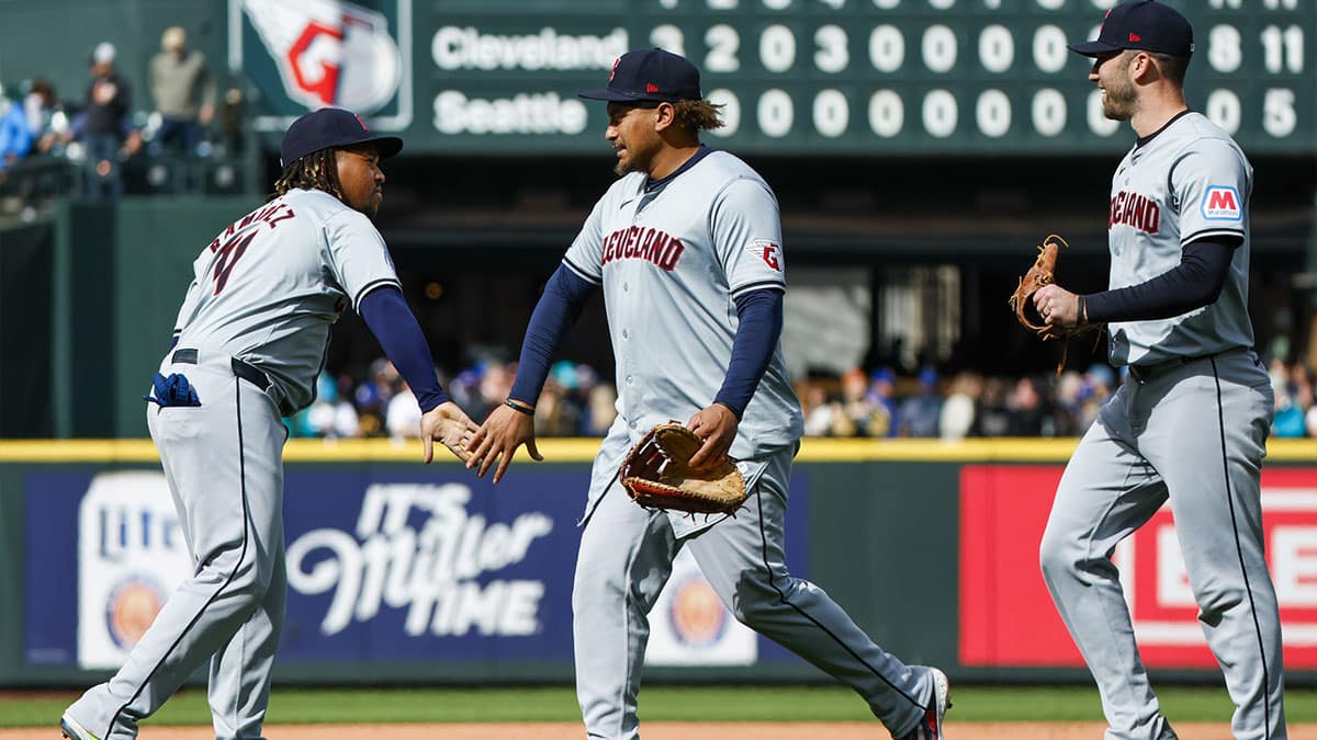 Cleveland Guardians designated hitter Jose Ramirez (11, left) celebrates with first baseman Josh Naylor (22, middle) and first baseman David Fry (6, right) following an 8-0 victory against the Seattle Mariners at T-Mobile Park.