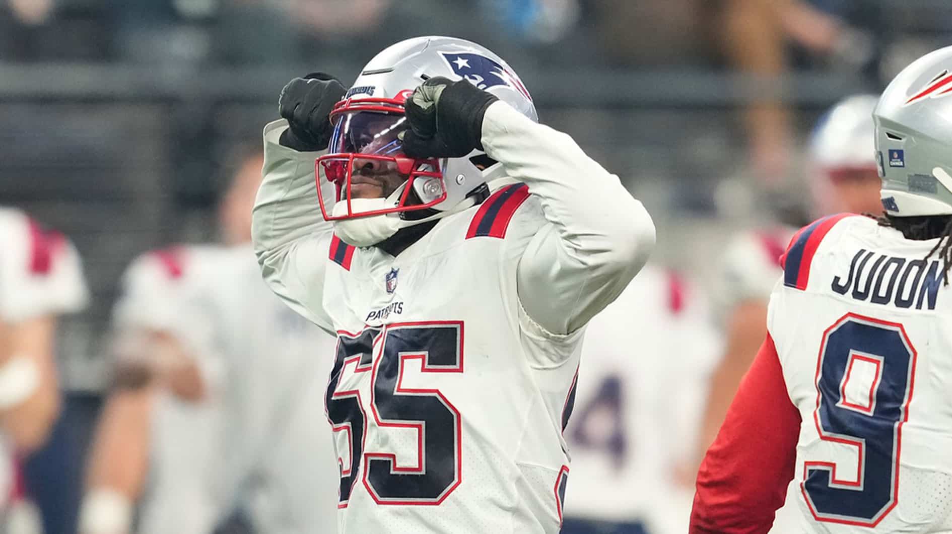 New England Patriots linebacker Josh Uche (55) celebrates after getting a sack against the Las Vegas Raiders during the second half at Allegiant Stadium.
