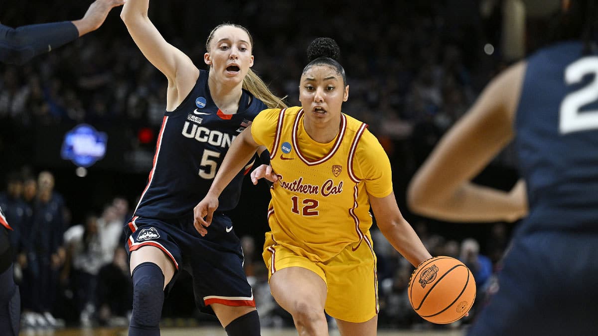 USC Trojans guard JuJu Watkins (12) drives to the basket during the second half against UConn Huskies guard Paige Bueckers (5) in the finals of the Portland Regional of the NCAA Tournament at the Moda Center