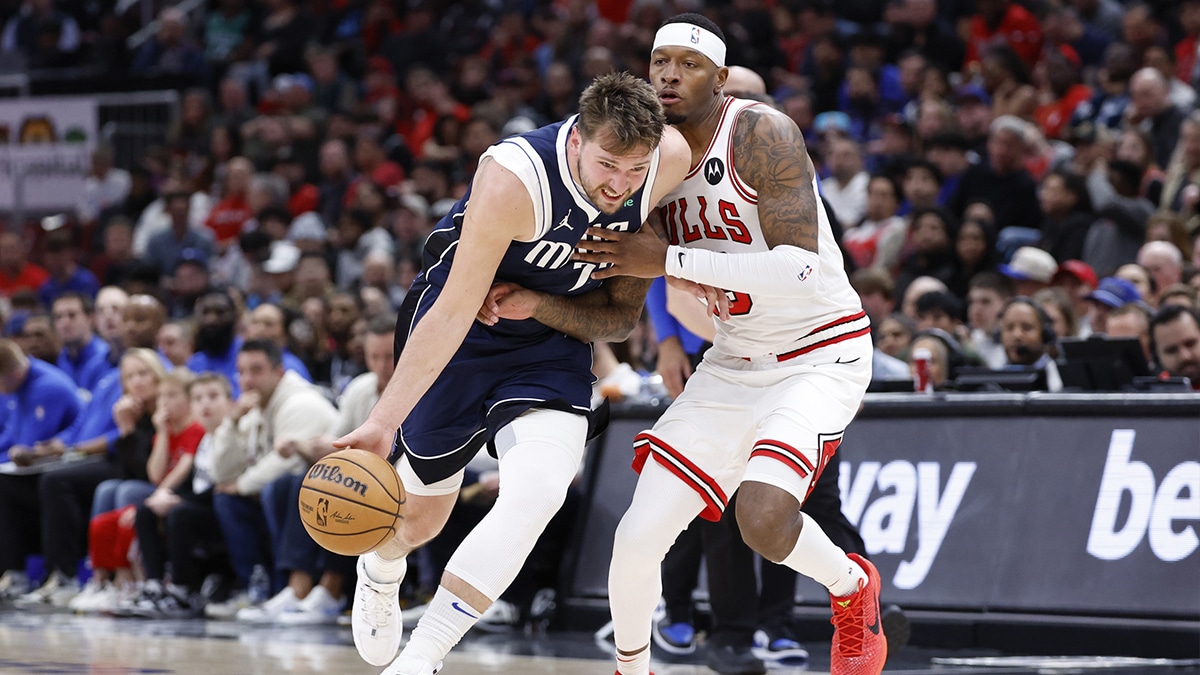 Dallas Mavericks guard Luka Doncic (77) drives to the basket against Chicago Bulls forward Julian Phillips (15) during the second half at United Center.