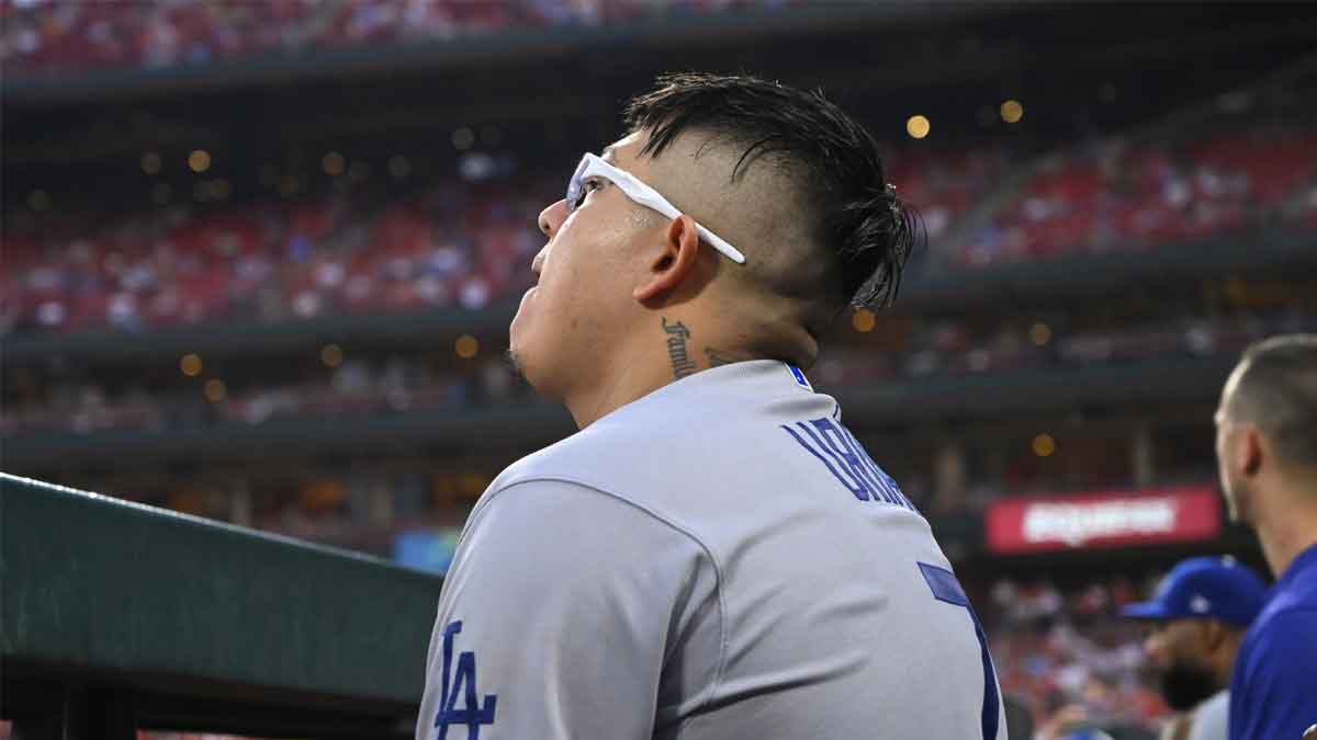 Los Angeles Dodgers starting pitcher Julio Urias (7) looks on from the dugout in the fourth inning in a game against the St. Louis Cardinals at Busch Stadium.