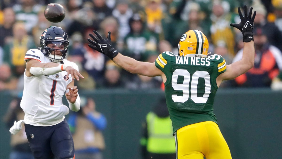 Chicago Bears quarterback Justin Fields (1) throwns under pressure from Green Bay Packers linebacker Lukas Van Ness (90) during their football game Sunday, January 7, 2024, at Lambeau Field in Green Bay, Wis. The Packers defeated the Bears 17-9. 