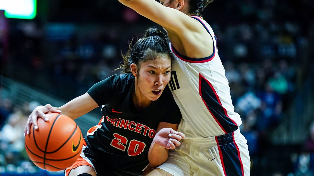Princeton Tigers guard Kaitlyn Chen (20) drives the ball against UConn Huskies forward Lou Lopez-Senechal (11) in the second half.