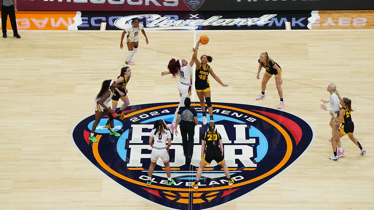 South Carolina Gamecocks center Kamilla Cardoso (10) and Iowa Hawkeyes forward Hannah Stuelke (45) jump for opening tip off in the first quarter in the finals of the Final Four of the womens 2024 NCAA Tournament at Rocket Mortgage FieldHouse