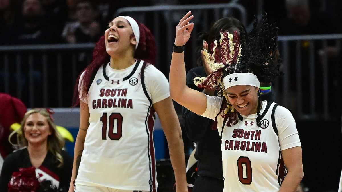 South Carolina Gamecocks center Kamilla Cardoso (10) and guard Te-Hina Paopao (0) react on the bench against the NC State Wolfpack in the semifinals of the Final Four of the womens 2024 NCAA Tournament at Rocket Mortgage FieldHouse