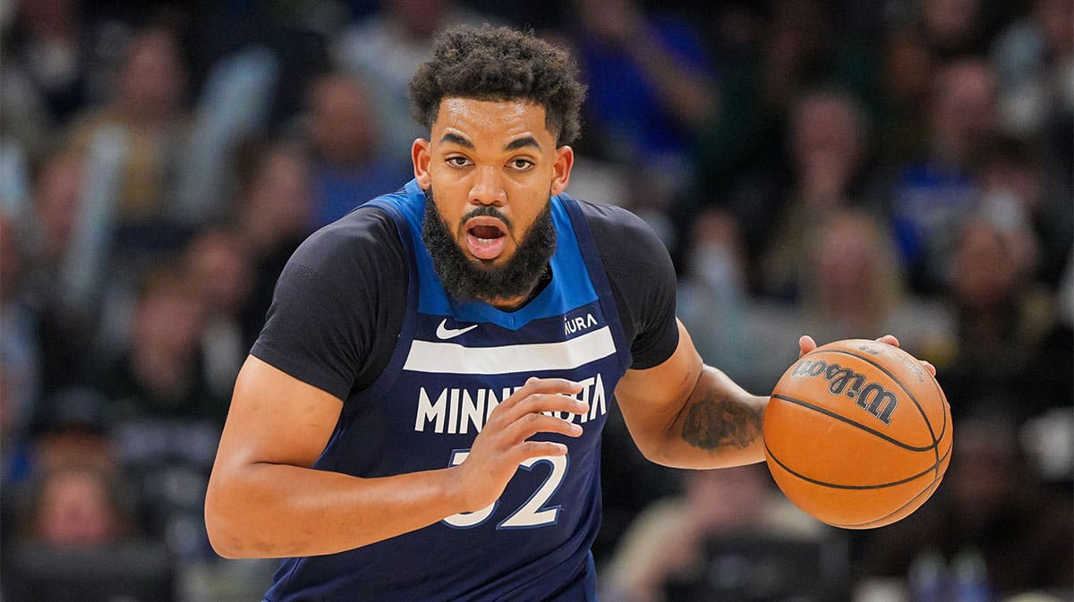 Minnesota Timberwolves center Karl-Anthony Towns (32) dribbles against the Portland Trail Blazers in the third quarter at Target Center.