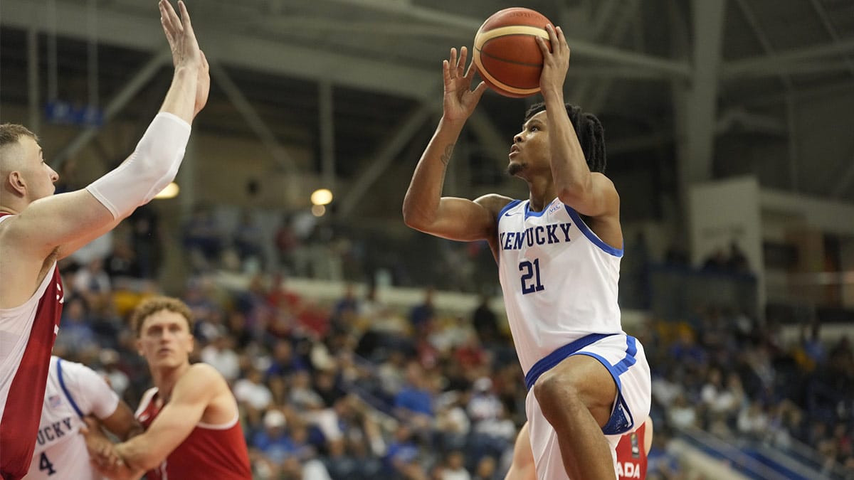 USA-Kentucky guard DJ Wagner (21) goes up to make a basket as Canada forward Thomas Kennedy (54) defends during the second half of the Men's Gold game at Mattamy Athletic Centre.