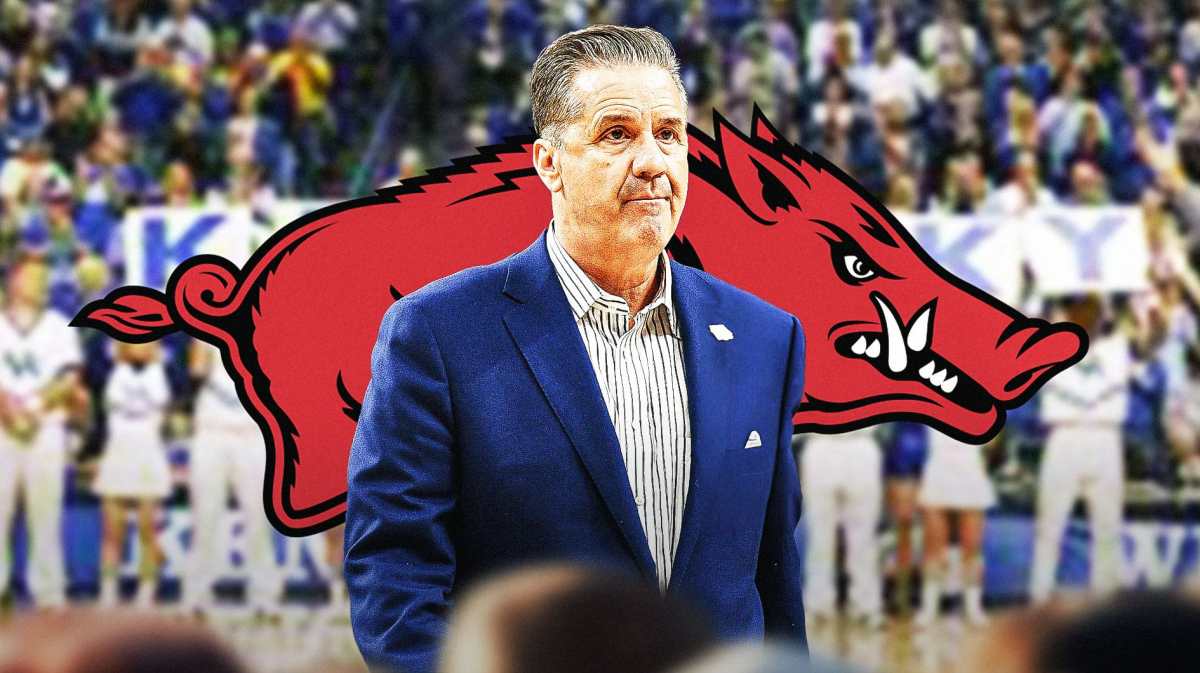 Kentucky basketball coach John Calipari stands in front of Arkansas logo after contract news