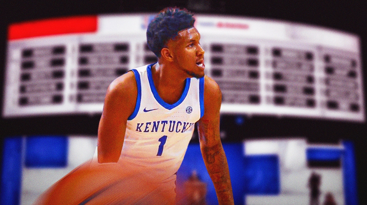 Justin Edwards with NBA Draft board behind him.