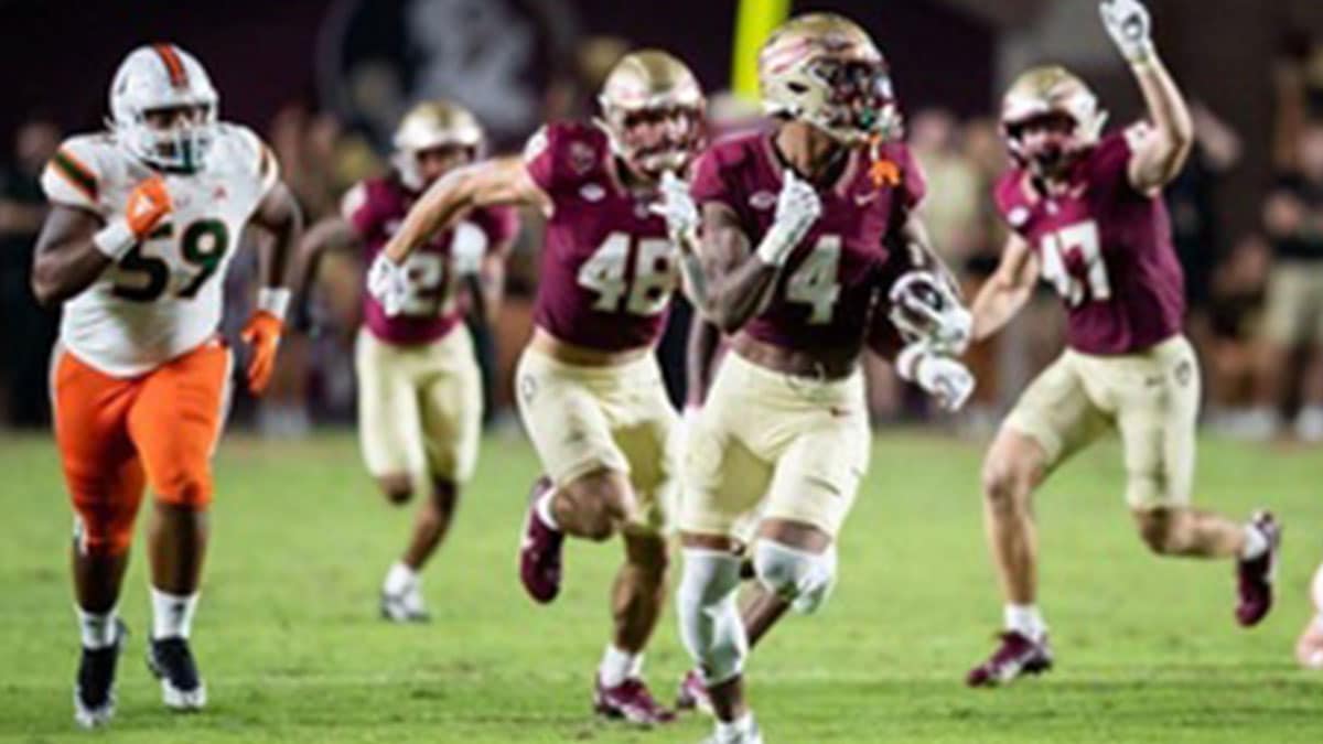 Seminoles wide receiver Keon Coleman sprints down the sideline in FSU's matchup with the Miami Hurricanes