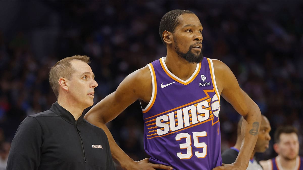  Phoenix Suns head coach Frank Vogel speaks with forward Kevin Durant (35) during a free throw by the Minnesota Timberwolves in the third quarter at Target Center.