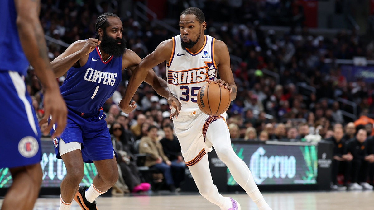 Phoenix Suns forward Kevin Durant (35) dribbles the ball against Los Angeles Clippers guard James Harden (1) during the fourth quarter at Crypto.com Arena. 