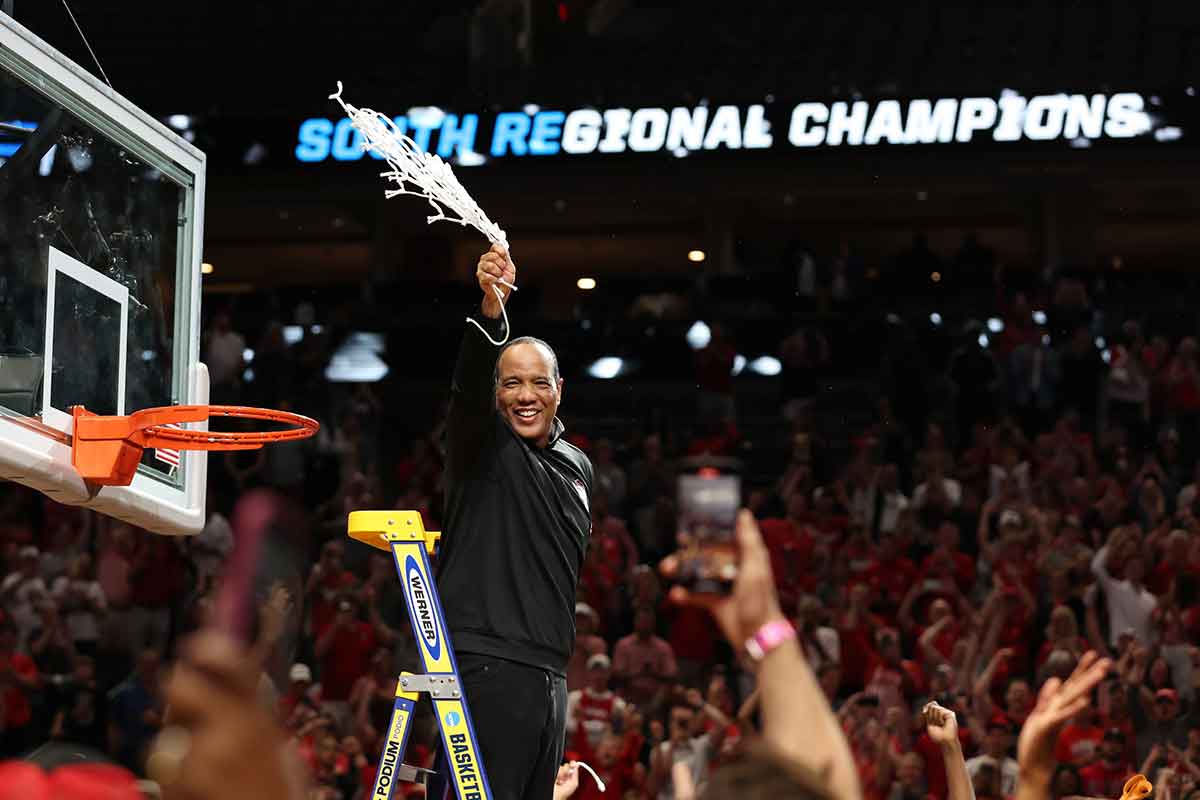 North Carolina State Wolfpack head coach Kevin Keatts cuts the net after defeating the Duke Blue Devils in the finals of the South Regional of the 2024 NCAA Tournament at American Airline Center.