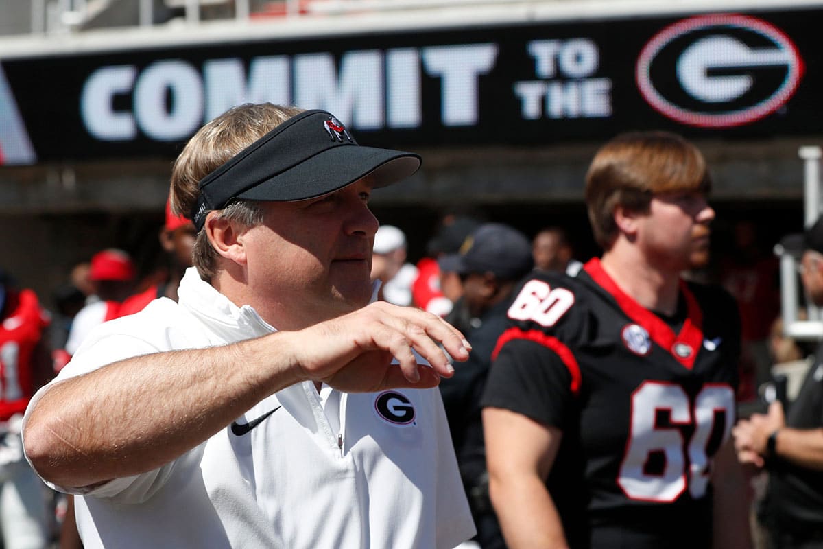 Georgia coach Kirby Smart arrives with the team before the start of the G-Day spring football game