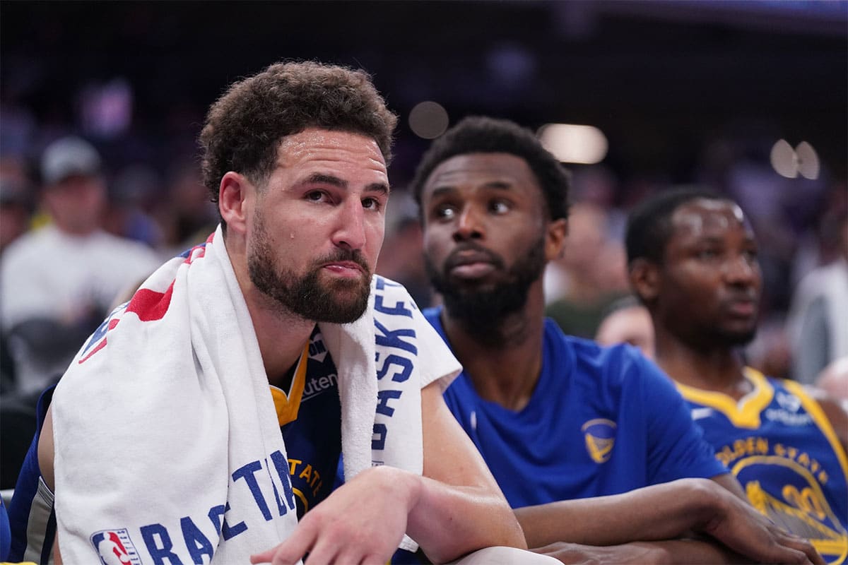 Golden State Warriors guard Klay Thompson (11) sits on the bench during action against the Sacramento Kings in the fourth quarter during a play-in game of the 2024 NBA playoffs at the Golden 1 Center.