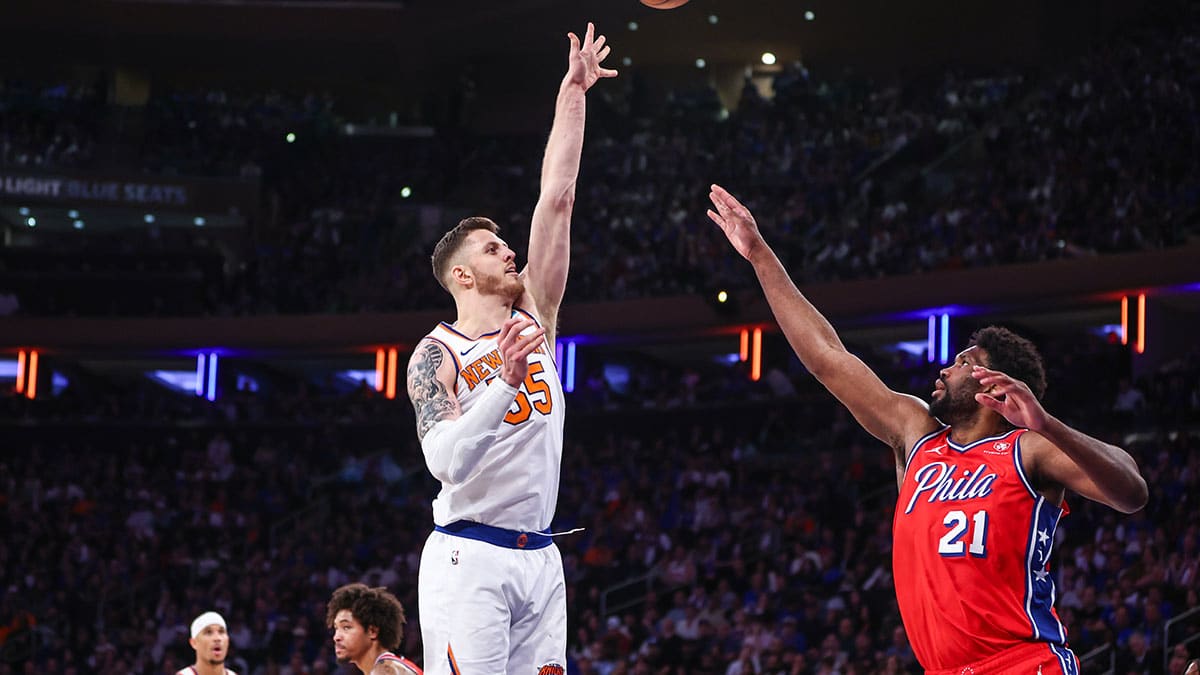 ew York Knicks center Isaiah Hartenstein (55) shoots over Philadelphia 76ers center Joel Embiid (21) in the third quarter in game one of the first round for the 2024 NBA playoffs at Madison Square Garden.