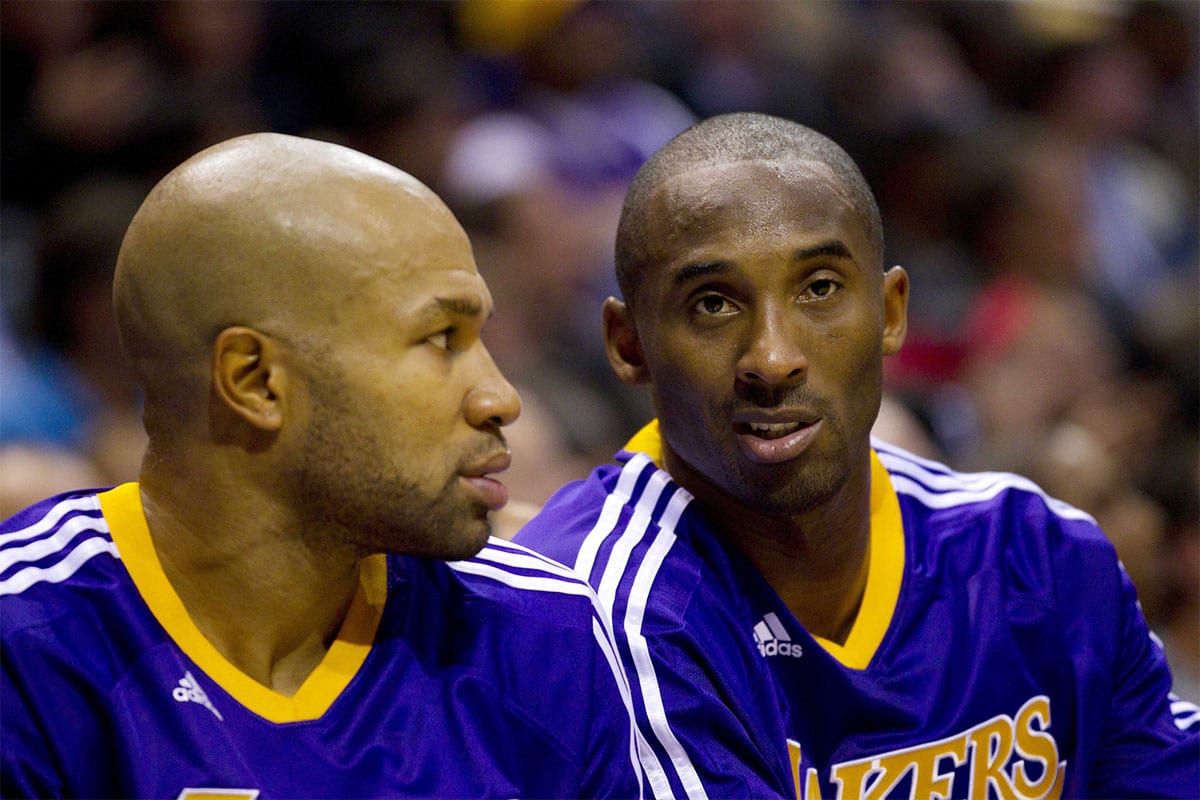 Los Angeles Lakers guard Kobe Bryant (right) talks with guard Derek Fisher (left) during the game against the Milwaukee Bucks at the Bradley Center. The Lakers defeated the Bucks 118-107