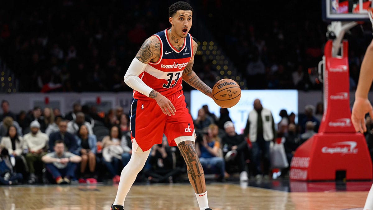 Washington Wizards forward Kyle Kuzma (33) brings the ball up court against the Detroit Pistons during the second quarter at Capital One Arena