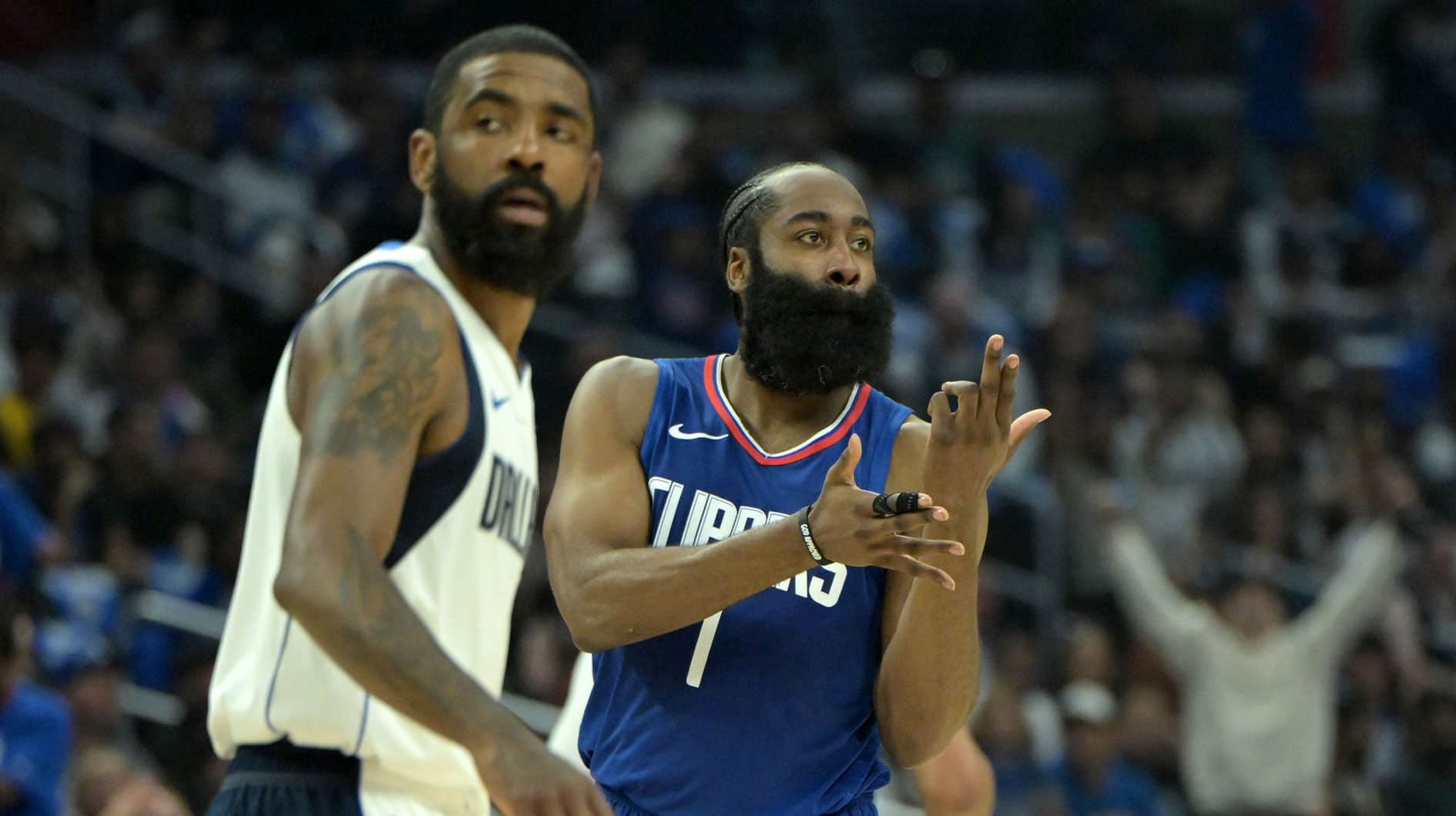 Los Angeles Clippers guard James Harden (1) signals after a 3-point basket over Dallas Mavericks guard Kyrie Irving (11) in the first half at Crypto.com Arena.
