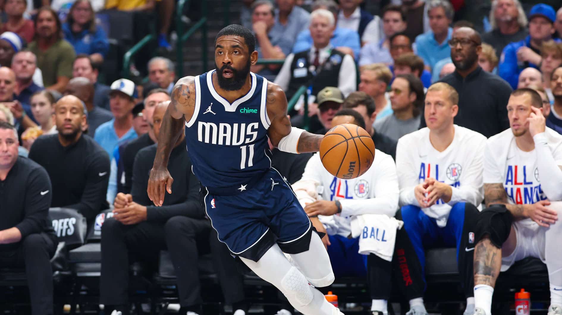 Dallas Mavericks guard Kyrie Irving (11) dribbles during the first quarter against the LA Clippers during game four of the first round for the 2024 NBA playoffs at American Airlines Center. 