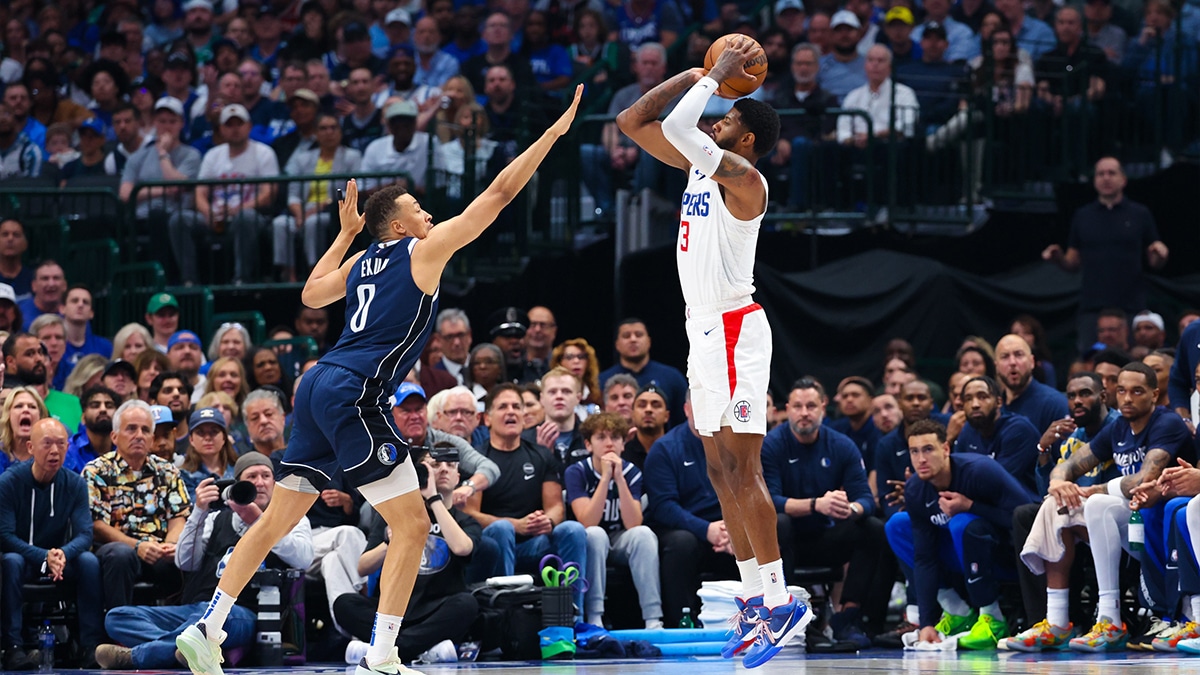 Apr 28, 2024; Dallas, Texas, USA; LA Clippers forward Paul George (13) shoots over Dallas Mavericks guard Dante Exum (0) during the first half during game four of the first round for the 2024 NBA playoffs at American Airlines Center. Mandatory Credit: Kevin Jairaj-USA TODAY Sports