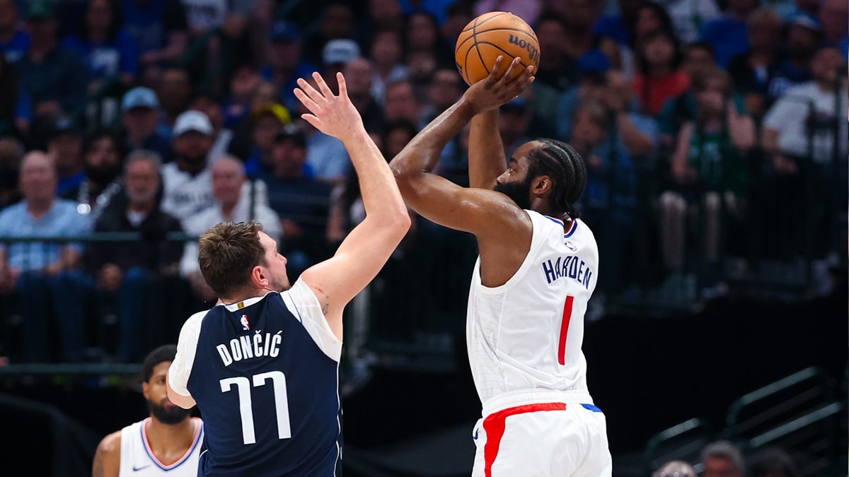 Apr 28, 2024; Dallas, Texas, USA; LA Clippers guard James Harden (1) shoots over Dallas Mavericks guard Luka Doncic (77) during the first half during game four of the first round for the 2024 NBA playoffs at American Airlines Center. Mandatory Credit: Kevin Jairaj-USA TODAY Sports