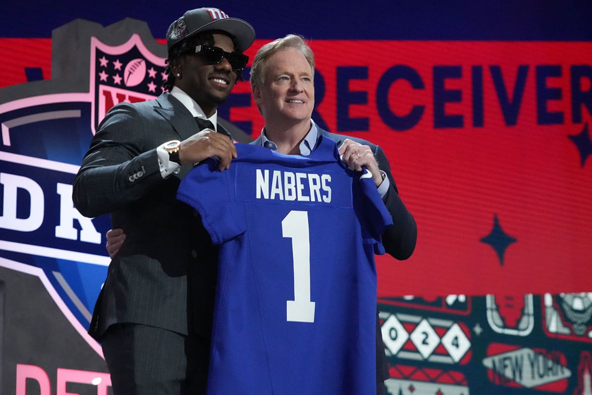 LSU Tigers wide receiver Malik Nabers poses with NFL commissioner Roger Goodell after being selected by the New York Giants as the No. 6 pick in the first round of the 2024 NFL Draft at Campus Martius Park and Hart Plaza.