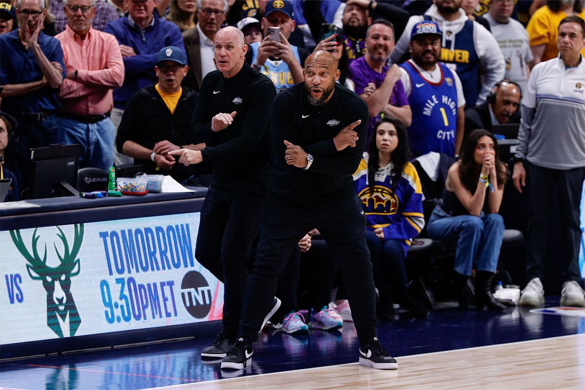 Los Angeles Lakers head coach Darvin Ham (R) and assistant coach Chris Jent (L) gesture in the fourth quarter against the Denver Nuggets during game five of the first round for the 2024 NBA playoffs at Ball Arena.