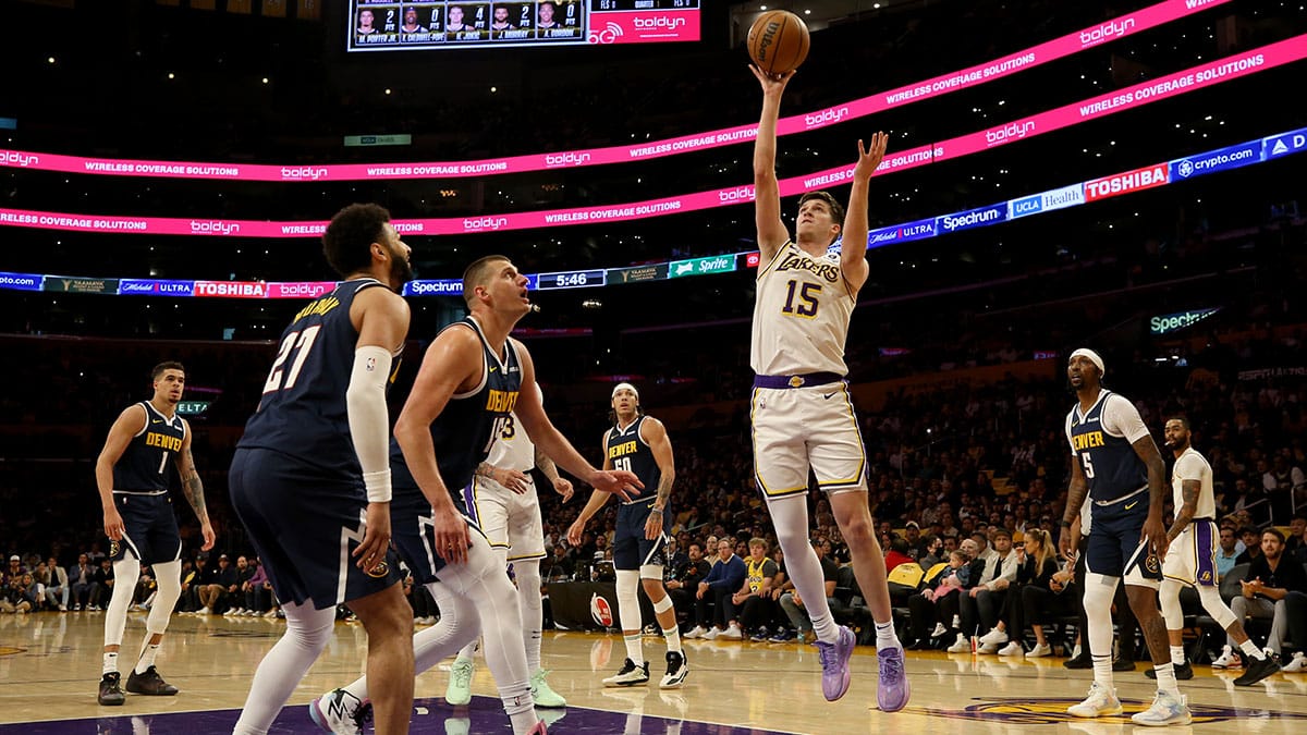 Los Angeles Lakers guard Austin Reaves (15) shoots against Denver Nuggets center Nikola Jokic (15) during the first quarter in game four of the first round for the 2024 NBA playoffs at Crypto.com Arena 