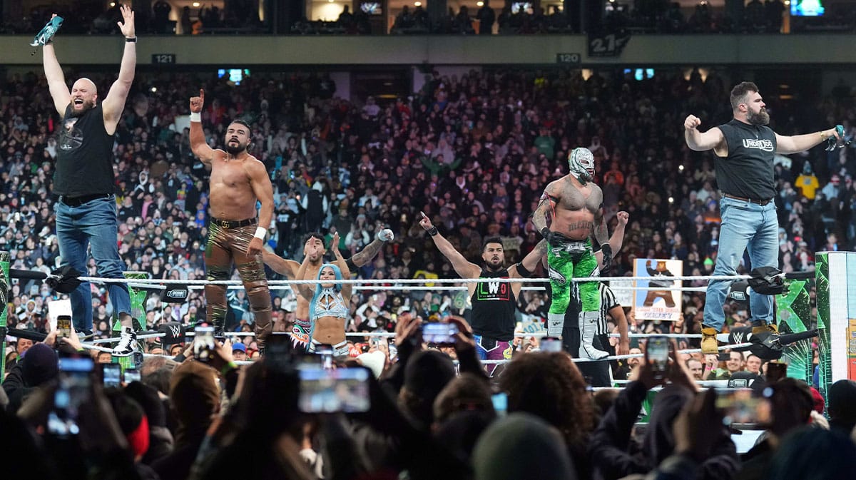 Philadelphia Eagles players Lane Johnson (left) and Jason Kelce (right) appear during Rey Mysterio & Dragon Lee vs. Dominik Mysterio & Santos Escobar during Wrestlemania XL Saturday at Lincoln Financial Field.