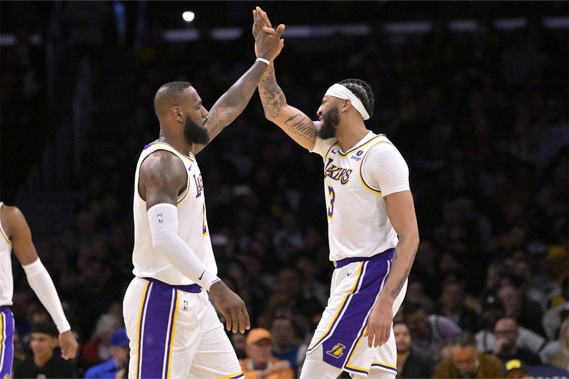 os Angeles Lakers forward LeBron James (23) and forward Anthony Davis (3) high-five after a play in the first half against the Indiana Pacers at Crypto.com Arena.