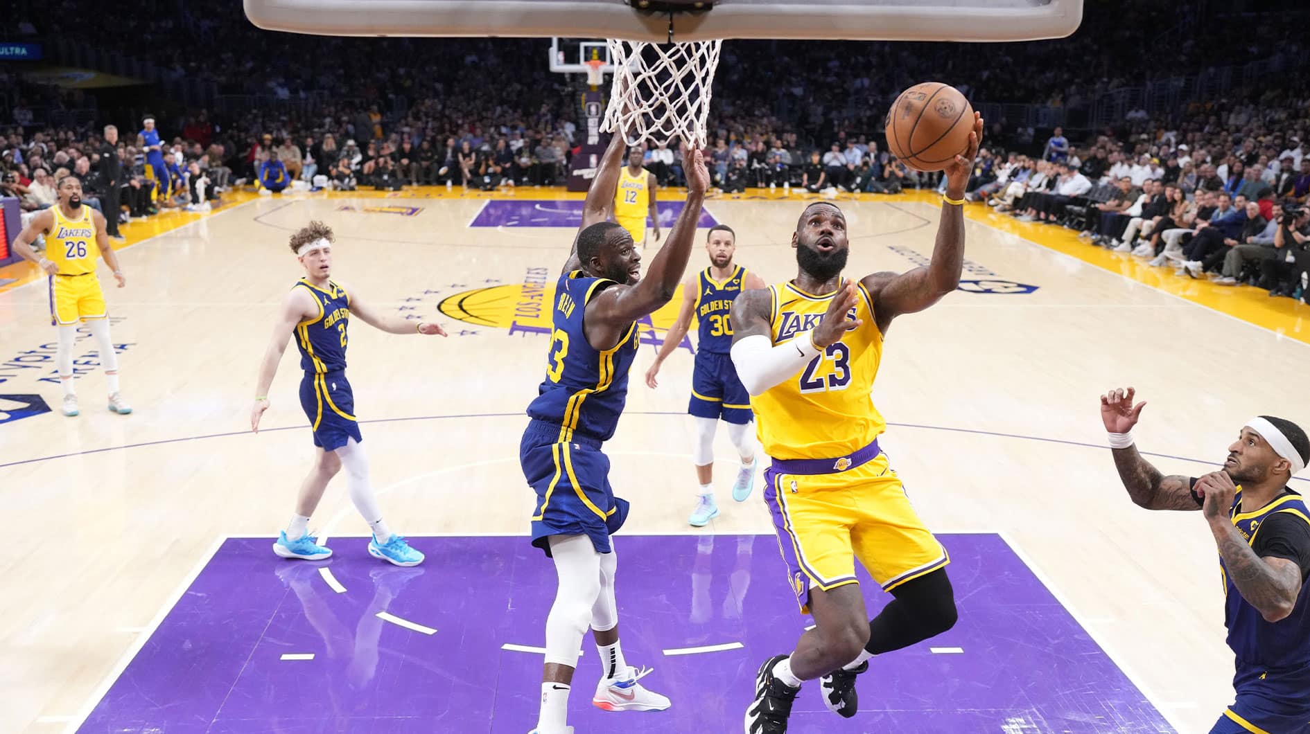 Los Angeles Lakers forward LeBron James (23) shoots the ball against Golden State Warriors forward Draymond Green (23) in the second half at Crypto.com Arena.