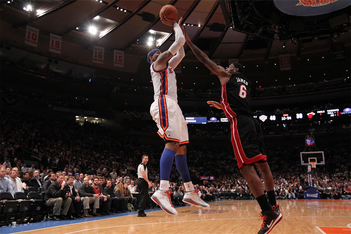 LeBron James playing against New York Knicks player Carmelo Anthony