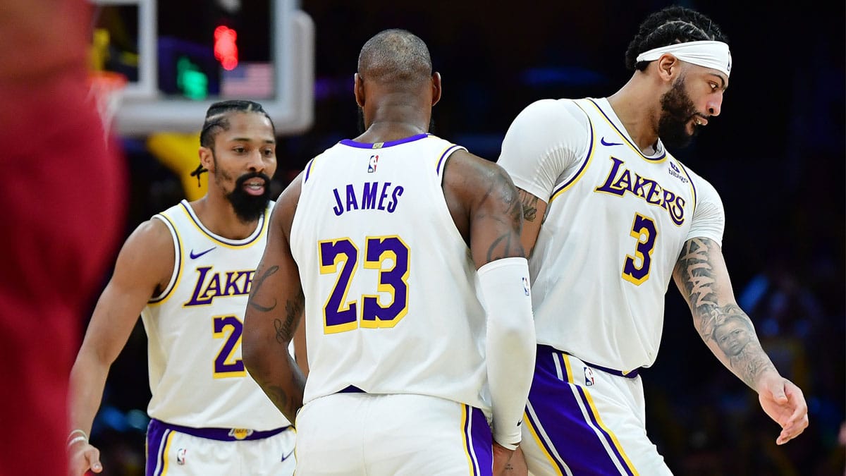 Los Angeles Lakers forward LeBron James (23) greets guard Spencer Dinwiddie (26) and forward Anthony Davis (3) during the second half at Crypto.com Arena. 