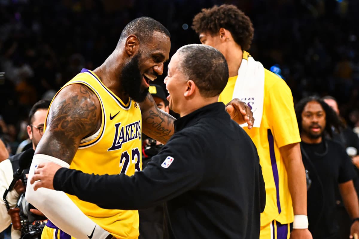 Los Angeles Lakers forward LeBron James (23) embraces head coach Tyronn Lue of the LA Clippers after the Lakers won during overtime at Crypto.com Arena.