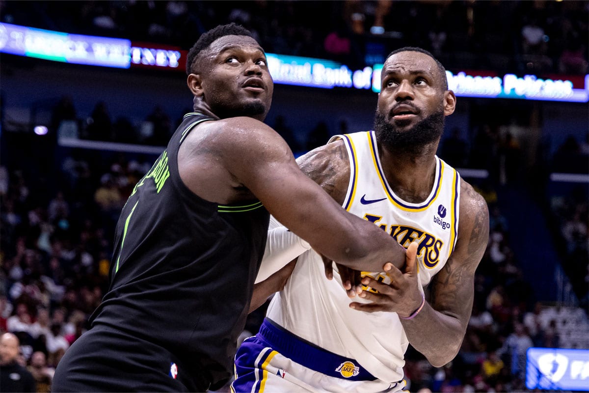 Los Angeles Lakers forward LeBron James (23) and New Orleans Pelicans forward Zion Williamson (1) fight for position during the second half at Smoothie King Center