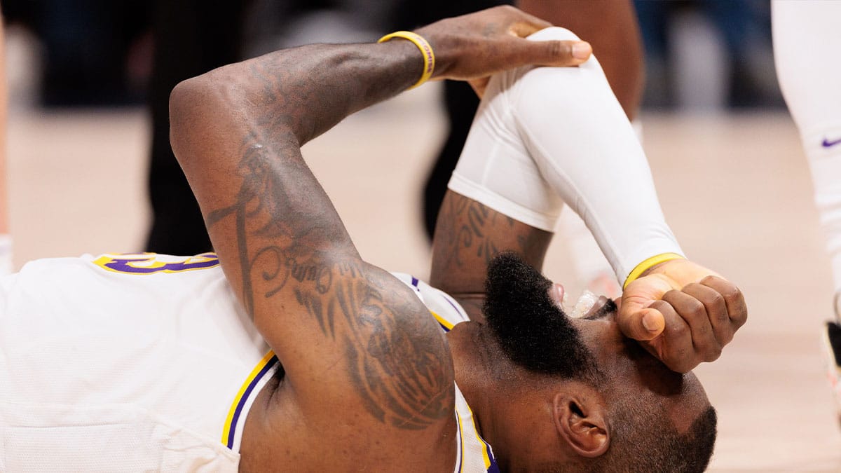 Los Angeles Lakers forward LeBron James (23) reacts on the court floor during the fourth quarter against the Denver Nuggets in game one of the first round for the 2024 NBA playoffs at Ball Arena