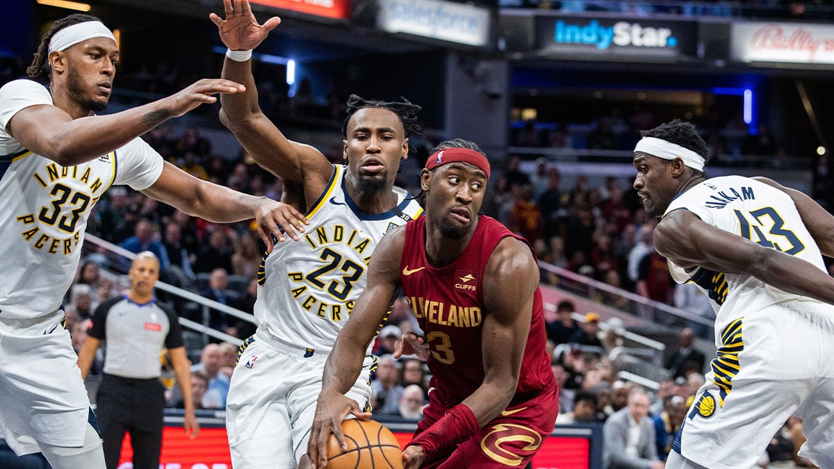 Cleveland Cavaliers guard Caris LeVert (3) passes the ball while Indiana Pacers center Myles Turner (33) forward Aaron Nesmith (23) and forward Pascal Siakam (43) defend in the second half at Gainbridge Fieldhouse. 