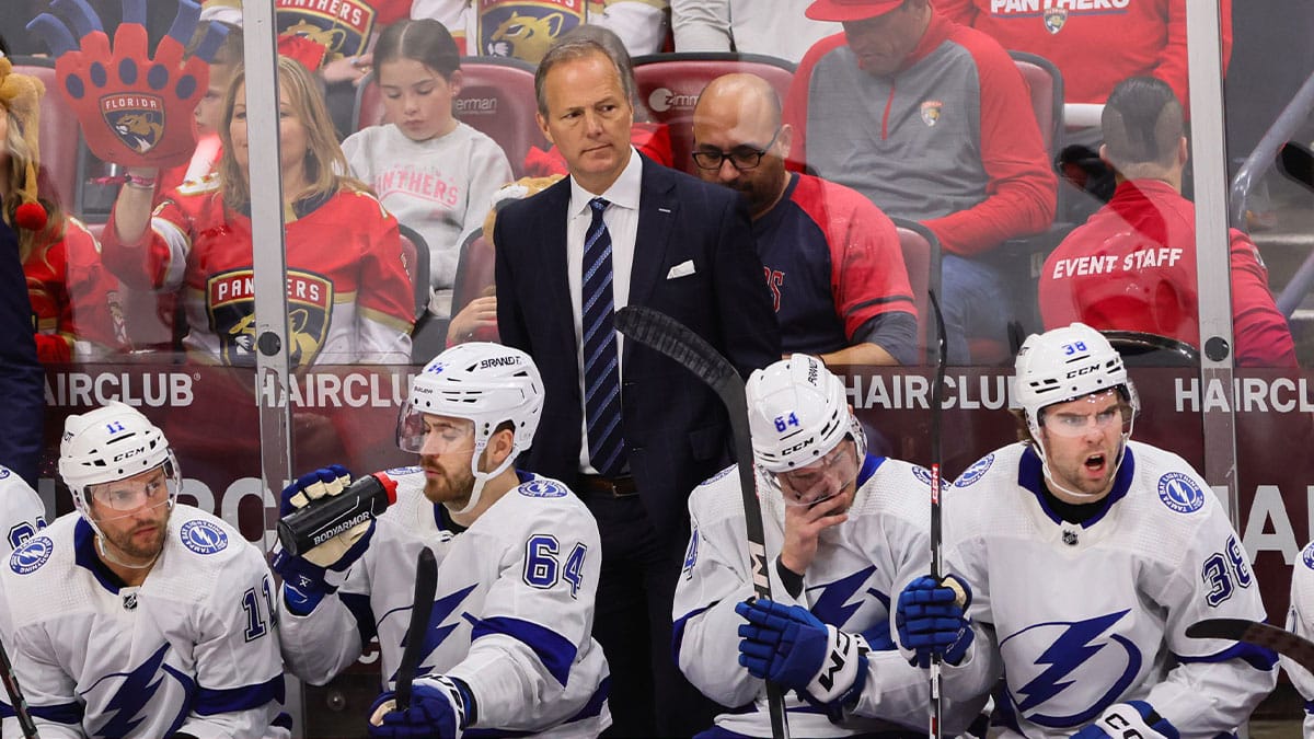 Tampa Bay Lightning head coach Jon Cooper looks on from the bench against the Florida Panthers during the third period in game one of the first round of the 2024 Stanley Cup Playoffs at Amerant Bank Arena.
