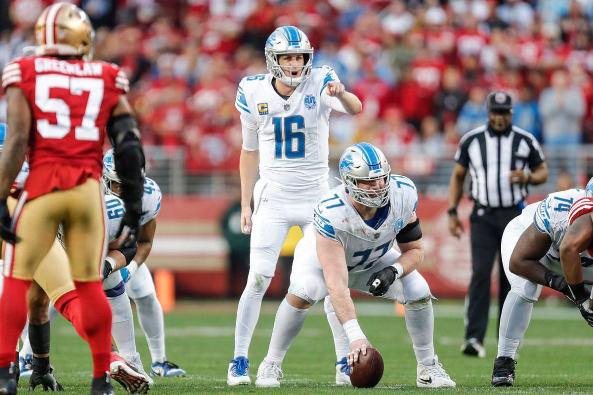 Lions quarterback Jared Goff talks to center Frank Ragnow before a snap against 49ers during the first half of the NFC championship game at Levi's Stadium in Santa Clara, California, on Sunday, Jan. 28, 2024.