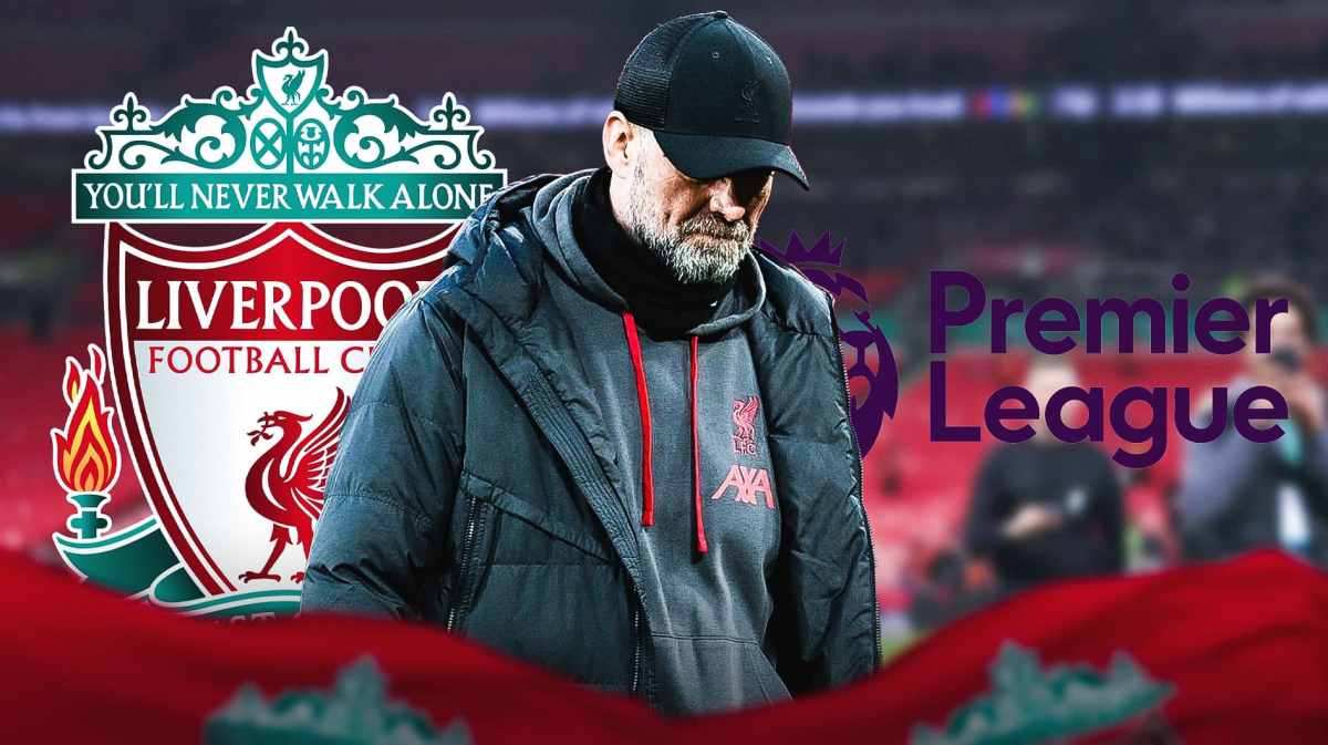 Jurgen Klopp looking down/sad in front of the Liverpool and Premier League logos