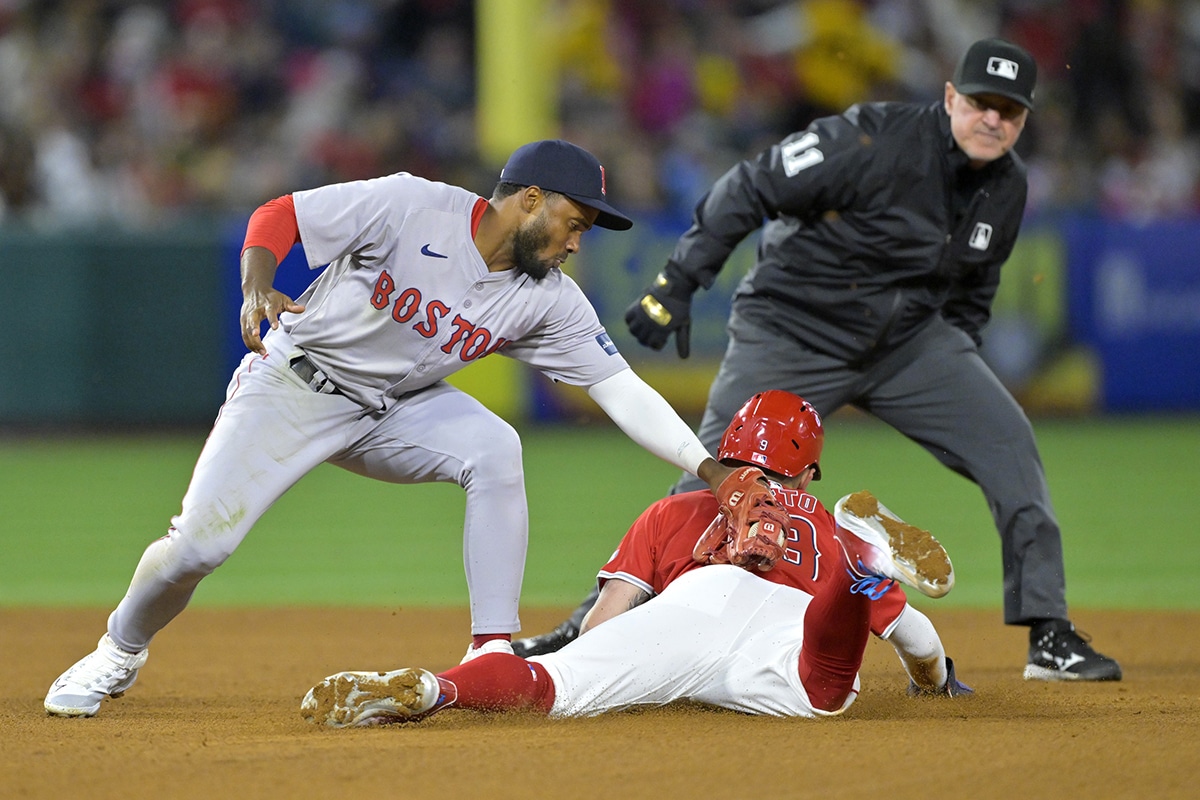 Los Angeles Angels shortstop Zach Neto (9) beats the throw to Boston Red Sox second base Pablo Reyes (19) for a stolen base in the fifth inning at Angel Stadium. 