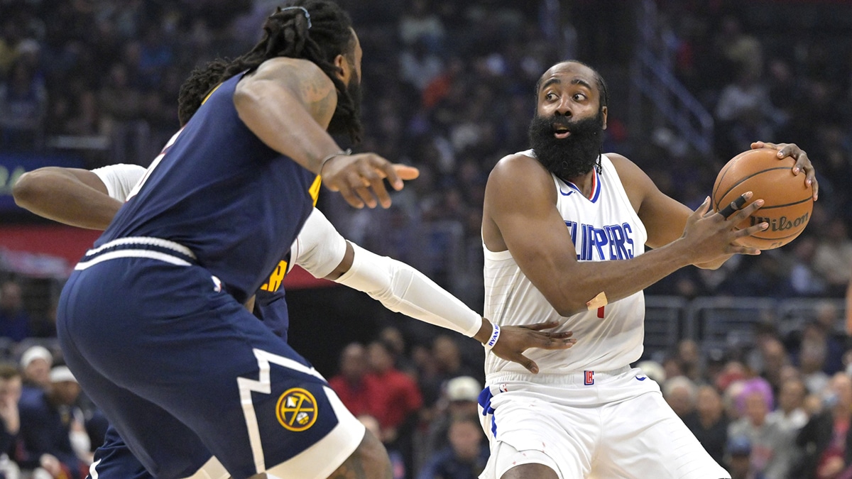 Apr 4, 2024; Los Angeles, California, USA; Los Angeles Clippers guard James Harden (1) is defended by Denver Nuggets center DeAndre Jordan (6) in the first half at Crypto.com Arena. Mandatory Credit: Jayne Kamin-Oncea-USA TODAY Sports