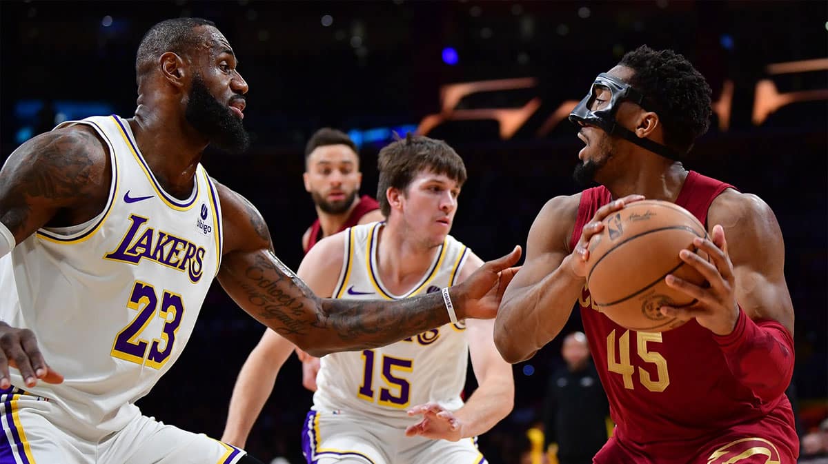 Los Angeles Lakers' LeBron James guarding Cleveland Cavaliers' Donovan Mitchell
