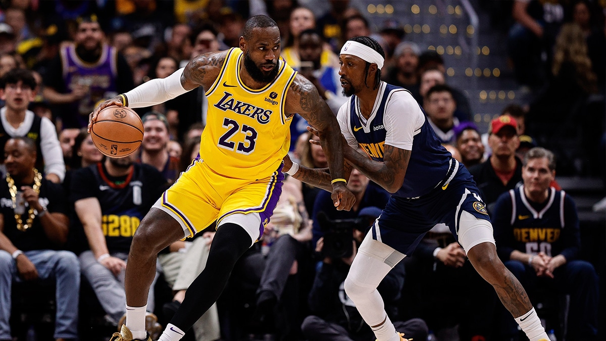 Los Angeles Lakers forward LeBron James (23) controls the ball as Denver Nuggets guard Kentavious Caldwell-Pope (5) guards in the third quarter during game five of the first round for the 2024 NBA playoffs at Ball Arena.