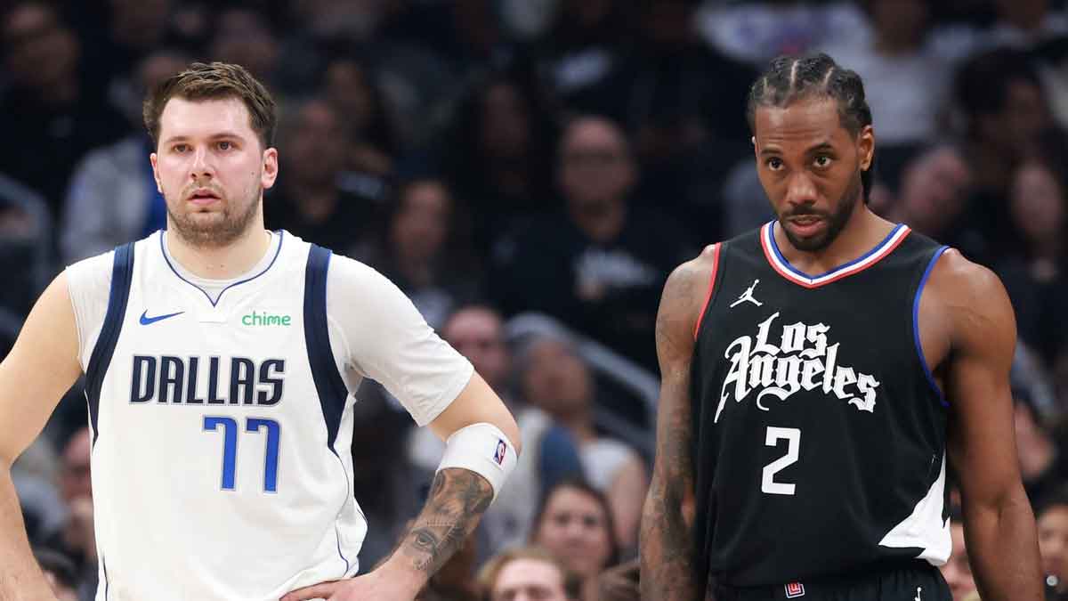 Dallas Mavericks guard Luka Doncic (77) and Los Angeles Clippers forward Kawhi Leonard (2) stand on the floor during the first quarter of game two of the first round for the 2024 NBA playoffs at Crypto.com Arena. 