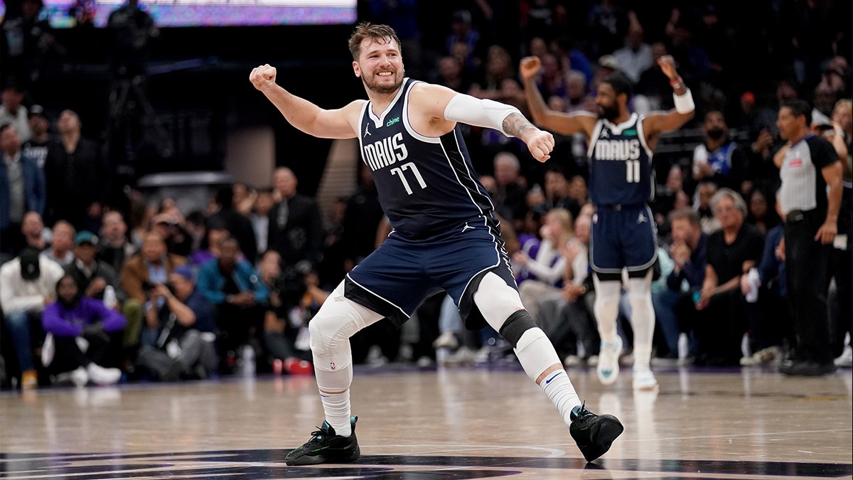 Dallas Mavericks guard Luka Doncic (77) celebrates after the Mavericks made a three point basket against the Sacramento Kings late in the fourth quarter at the Golden 1 Center.