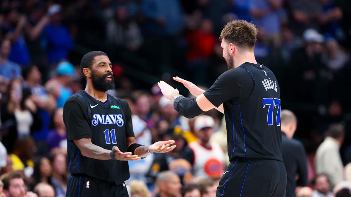 Dallas Mavericks guard Kyrie Irving (11) celebrates with Dallas Mavericks guard Luka Doncic (77) during the second half against the Phoenix Suns at American Airlines Center. 