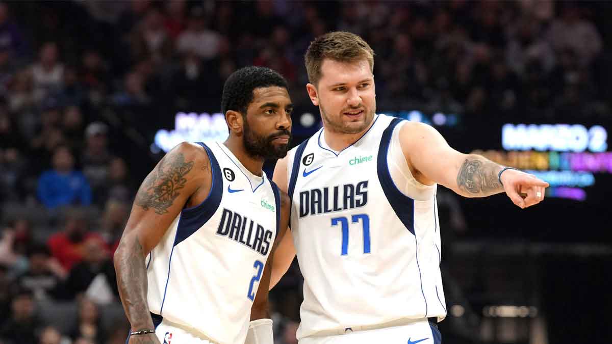 Dallas Mavericks guard Kyrie Irving (2) and guard Luka Doncic (77) talk during the first quarter against the Sacramento Kings at Golden 1 Center. 