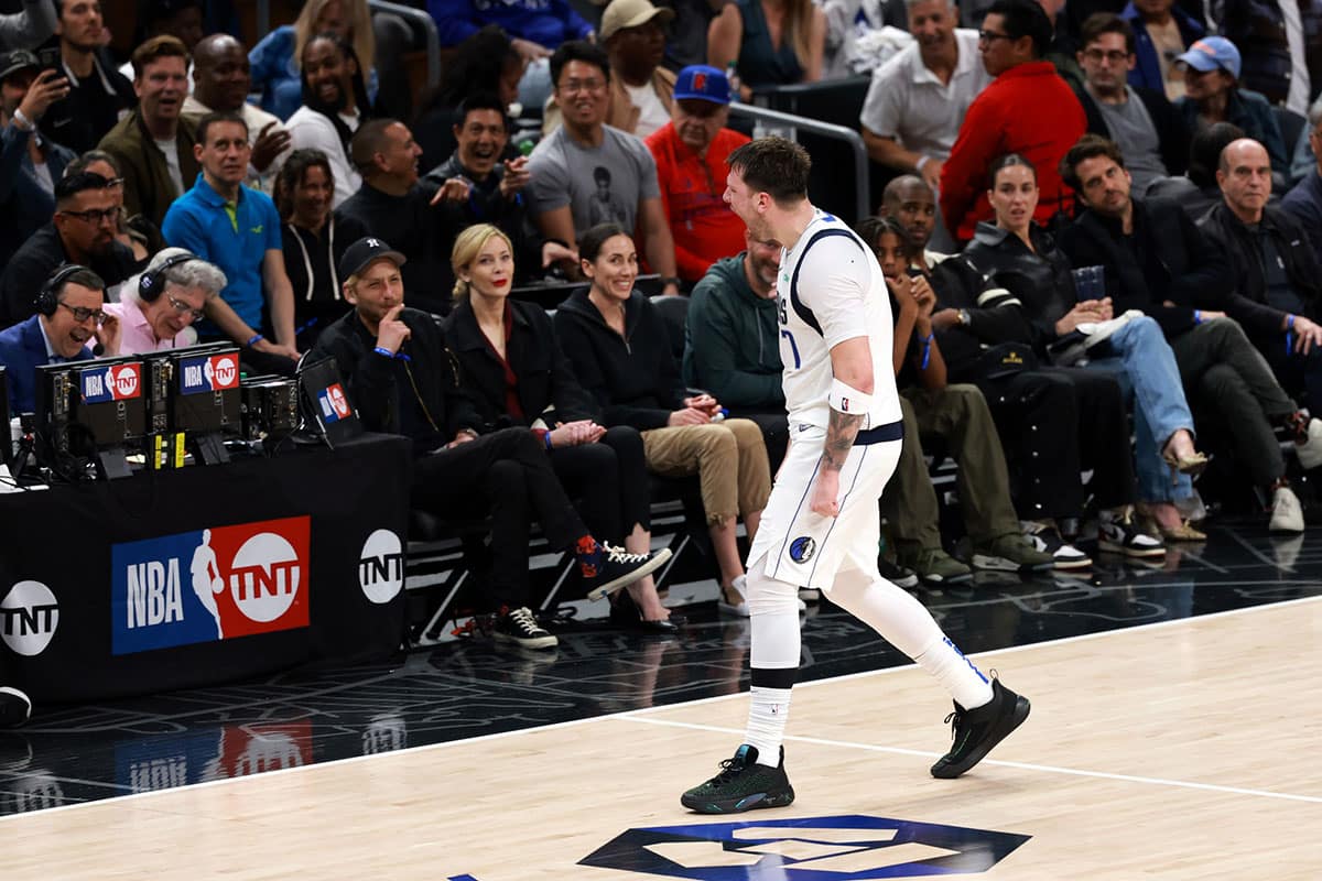 Dallas Mavericks guard Luka Doncic (77) reacts after making a three-point basket during the fourth quarter of game two of the first round for the 2024 NBA playoffs against the Los Angeles Clippers at Crypto.com Arena. 